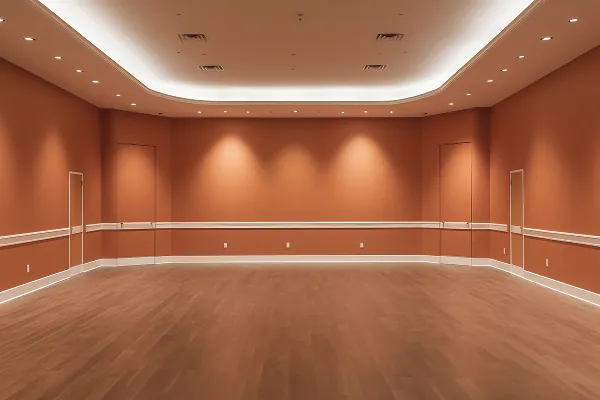 sala sem móveis, com paredes amadeiradas uma sanca em gesso com varias luminárias tipo spot iluminando a parede.